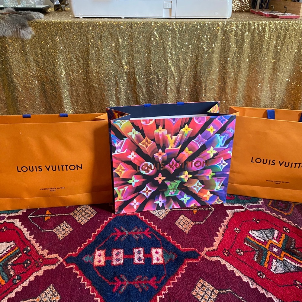 All three Louis Vuitton shopping bags!